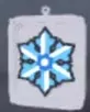 Silver air freshener tag with a blue and white snowflake.